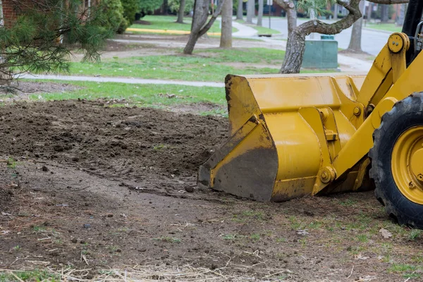 depositphotos_467470202-stock-photo-small-tractor-digging-land-working